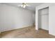 Bedroom with ceiling fan, neutral carpet, and closet space at 2232 Aspen Mirror Way # 202, Laughlin, NV 89029