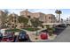 Well-maintained residential complex with lush landscaping, shaded parking, and serene walking paths, surrounded by mountains at 2232 Aspen Mirror Way # 202, Laughlin, NV 89029