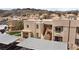 Exterior view of the condos nestled in the surrounding mountainside at 2232 Aspen Mirror Way # 202, Laughlin, NV 89029