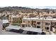 Exterior featuring covered parking spaces and well-maintained landscaping, and mountain views at 2232 Aspen Mirror Way # 202, Laughlin, NV 89029