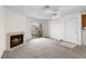 Inviting living room with carpet, fireplace, sliding glass door and ceiling fan at 2232 Aspen Mirror Way # 202, Laughlin, NV 89029