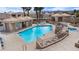 Inviting community pool with lounge seating, cabana, and immaculately landscaped surroundings, perfect for relaxing outdoors at 2232 Aspen Mirror Way # 202, Laughlin, NV 89029