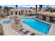 A large swimming pool and inviting patio area complete with lounge chairs at 2232 Aspen Mirror Way # 202, Laughlin, NV 89029
