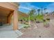 A desert landscaped backyard features multiple trees and gravel at 2353 Lauren Dr, Las Vegas, NV 89134