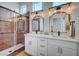 Modern bathroom with double vanity, sliding glass shower and stylish lighting at 2353 Lauren Dr, Las Vegas, NV 89134