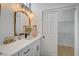 Modern bathroom vanity with vintage mirrors, storage and updated lighting at 2353 Lauren Dr, Las Vegas, NV 89134