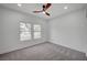 Bedroom features natural light from multiple windows and neutral carpeting at 2353 Lauren Dr, Las Vegas, NV 89134