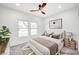 Comfortable bedroom with neutral tones, ample light, and cozy furnishings at 2353 Lauren Dr, Las Vegas, NV 89134
