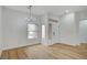 Bright dining area with wood floors and elegant lighting at 2353 Lauren Dr, Las Vegas, NV 89134