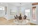 Cozy dining room featuring a round glass table, stylish seating, and bright natural light at 2353 Lauren Dr, Las Vegas, NV 89134