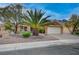 Attractive single-story home with desert landscaping, mature trees, and a two-car garage at 2353 Lauren Dr, Las Vegas, NV 89134