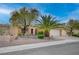 Inviting front yard featuring desert landscaping, mature trees, and a well-maintained facade at 2353 Lauren Dr, Las Vegas, NV 89134