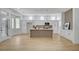 Bright living room and kitchen featuring wood floors and a modern fireplace at 2353 Lauren Dr, Las Vegas, NV 89134