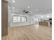 Bright, open-concept living room featuring wood floors, large windows, and a modern fireplace at 2353 Lauren Dr, Las Vegas, NV 89134