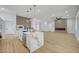 Open concept living space with a stunning kitchen island and modern fireplace feature at 2353 Lauren Dr, Las Vegas, NV 89134