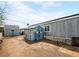 This backyard includes two sheds and a pathway, offering both storage and charm to the property at 240 Navajo Dr, Henderson, NV 89015