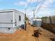 Backyard with tan colored dirt and a shed for additional storage at this residence at 240 Navajo Dr, Henderson, NV 89015