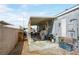 Backyard concrete patio and awning provide a great outdoor space for this home at 240 Navajo Dr, Henderson, NV 89015
