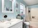 Bathroom featuring a shower and bathtub combo, toilet, and sink at 240 Navajo Dr, Henderson, NV 89015