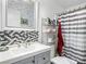 Modern bathroom with stylish mosaic backsplash, contemporary vanity, and a shower-tub combo at 240 Navajo Dr, Henderson, NV 89015