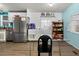 View of modern appliances and decor from glass dining room table and chairs at 240 Navajo Dr, Henderson, NV 89015