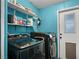 Functional laundry room with modern washer and dryer, offering convenience at 240 Navajo Dr, Henderson, NV 89015