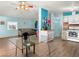 Cozy living room and kitchen space with wood floors, with couch, chairs, and modern stove at 240 Navajo Dr, Henderson, NV 89015