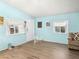 Bright living room with wood-look flooring, and windows offering natural light at 240 Navajo Dr, Henderson, NV 89015
