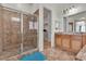 Tiled bathroom with glass enclosed shower, double vanity and walk in closet at 2673 Paris Amour St, Henderson, NV 89044