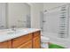 Bathroom featuring a single vanity and shower-tub combo with a shower curtain at 2673 Paris Amour St, Henderson, NV 89044