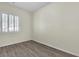 Bedroom with wood-look floors and bright window at 2673 Paris Amour St, Henderson, NV 89044