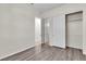 Bright bedroom boasts wood-look floors and closet with sliding doors at 2673 Paris Amour St, Henderson, NV 89044