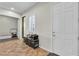 Bright entryway featuring tile floors, a storage piece, and access to bedroom and window at 2673 Paris Amour St, Henderson, NV 89044