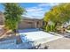 Inviting single-story home featuring a spacious driveway and desert-style landscaping at 2673 Paris Amour St, Henderson, NV 89044
