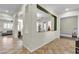 Open-concept hallway showcasing tile flooring and multiple rooms with natural light at 2673 Paris Amour St, Henderson, NV 89044