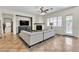 Living room with tile floors, a corner fireplace, and access to the backyard through a glass door at 2673 Paris Amour St, Henderson, NV 89044