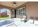Outdoor patio featuring a ceiling fan, sitting chair, artificial turf and barbecue at 2673 Paris Amour St, Henderson, NV 89044