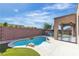 Inviting backyard with a sparkling pool, patio, and well-manicured landscaping, perfect for outdoor entertaining at 2673 Paris Amour St, Henderson, NV 89044