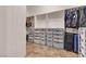 Spacious walk-in closet with shelves, drawers, and ample storage space at 2673 Paris Amour St, Henderson, NV 89044