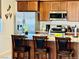 Modern kitchen featuring stainless steel appliances, granite countertops, and a center island with breakfast bar at 2719 Chinaberry Hill St, Laughlin, NV 89029