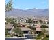 Scenic view of a well-maintained neighborhood with mountain views, showcasing community charm at 2719 Chinaberry Hill St, Laughlin, NV 89029
