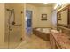 Beautiful bathroom features a walk-in shower, soaking tub and double sink vanity at 2740 Carolina Blue Ave, Henderson, NV 89052