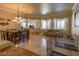 Charming dining room offers a chandelier lighting and blends into the living spaces at 2740 Carolina Blue Ave, Henderson, NV 89052