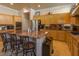 Gourmet kitchen with stainless appliances, granite counters, and breakfast bar seating at 2740 Carolina Blue Ave, Henderson, NV 89052