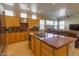 Open kitchen features a large island with a double sink and views of the living area at 2740 Carolina Blue Ave, Henderson, NV 89052