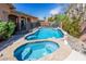 Sparkling pool and spa with mature landscaping provide an oasis in the backyard at 2740 Carolina Blue Ave, Henderson, NV 89052