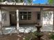 Inviting covered patio featuring a fountain and view of the rear of the home at 2855 Grande Valley Dr, Las Vegas, NV 89135