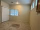 Bright dining area with tile flooring, a large window, and neutral tones, showcasing a clean and inviting interior at 2855 Grande Valley Dr, Las Vegas, NV 89135