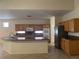 Bright kitchen with granite countertops, light wood cabinetry, and stainless appliances, spacious with ample lighting at 2855 Grande Valley Dr, Las Vegas, NV 89135