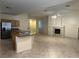 Modern kitchen with a large island, granite countertops, stainless steel appliances, and tiled flooring at 2855 Grande Valley Dr, Las Vegas, NV 89135